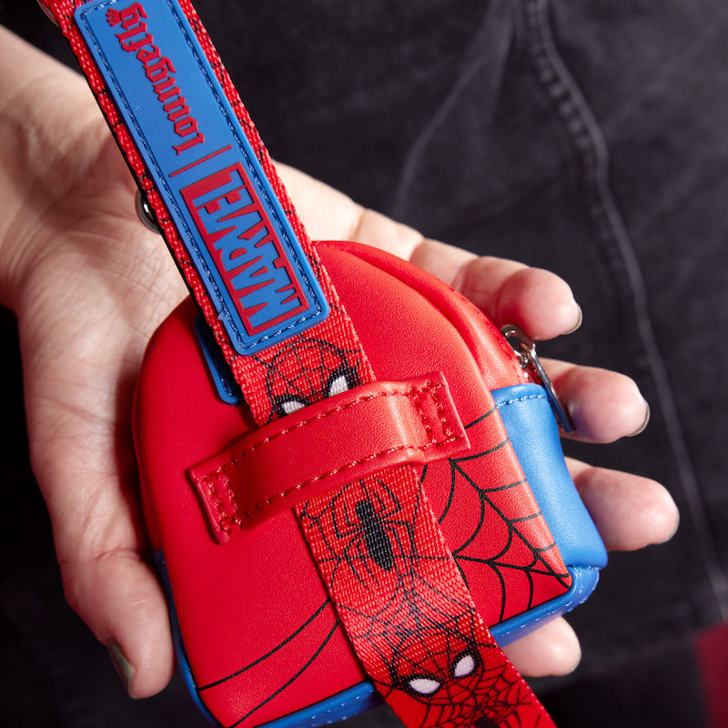 Image of someone holding the Spider-Man treat bag attached to the leash